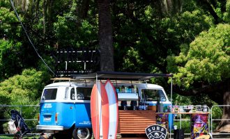 camper van surf cafe under some trees